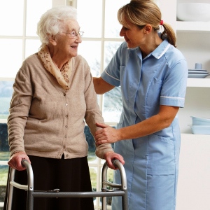 Caregiver offering support to an older adult